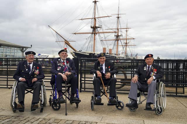 D-Day veterans from left: George Chandler, Joe Cattini, John Dennet and Jack Quinn are welcomed to the Portsmouth Historic Dockyard to commemorate the 77th anniversary of the Normandy Landings. Picture date: Sunday June 6, 2021. Picture: Steve Parsons/PA Wire