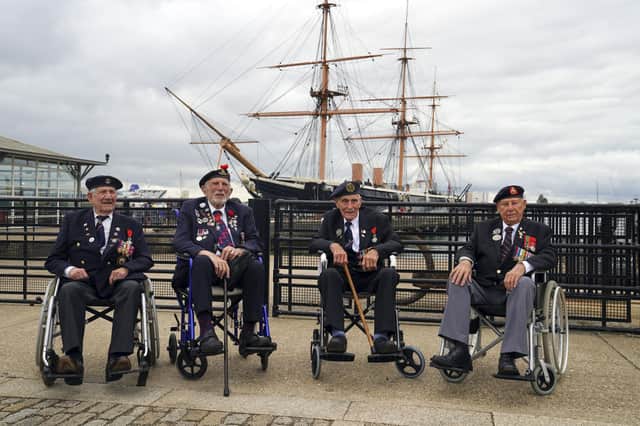 D-Day veterans from left: George Chandler, Joe Cattini, John Dennet and Jack Quinn are welcomed to the Portsmouth Historic Dockyard to commemorate the 77th anniversary of the Normandy Landings. Picture date: Sunday June 6, 2021. Picture: Steve Parsons/PA Wire