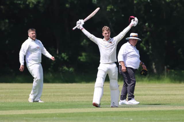 Harry Gadd celebrates reaching his century at Chapel Gate. Picture by James Robinson.