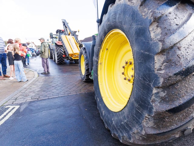 Crowds gathered in Wickham Square to watch the procession of tractors go by all to raise money for Rowans Hospice and Guide Dogs.