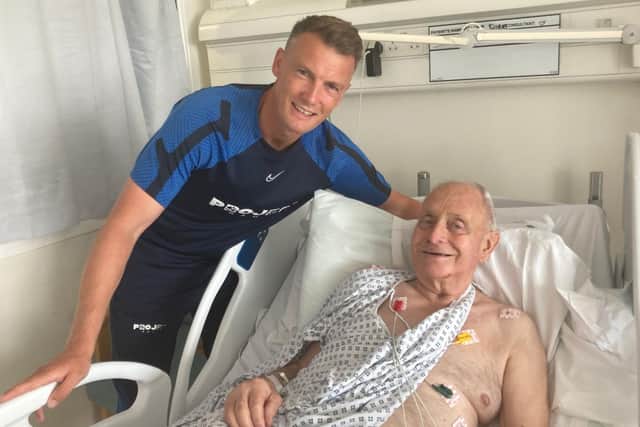 Peter Sanderson visits Malcolm Richards while he was recovering in QA Hospital