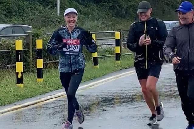 Libby Higgins, 19 from Waterlooville, took on the virtual London Marathon in honour of her friend who has leukaemia. Pictured: Libby running through the rain