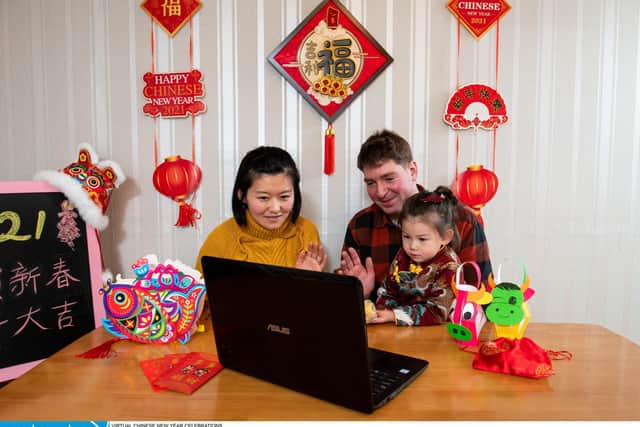 Yang Lu with her husband Gabor Varga and her daughter Eliza Varga (2) host a video call with Yang's parents who live in China as they prepare to celebrate Chinese New Year at their home in Portsmouth
© Jordan Pettitt/Solent News & Photo Agency