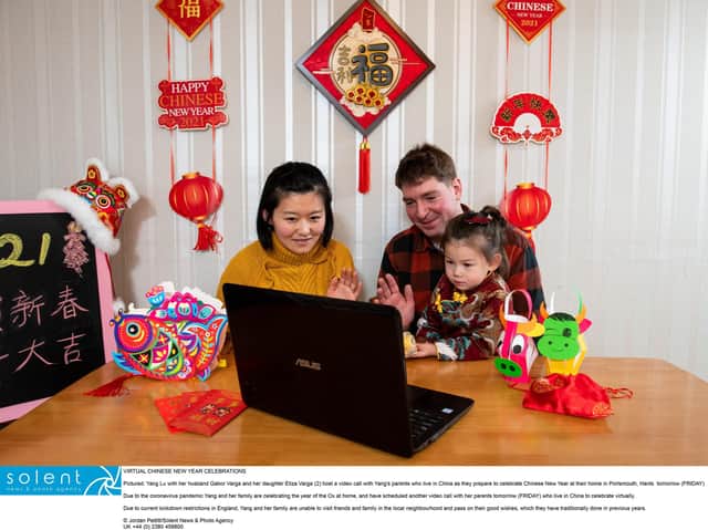 Yang Lu with her husband Gabor Varga and her daughter Eliza Varga (2) host a video call with Yang's parents who live in China as they prepare to celebrate Chinese New Year at their home in Portsmouth
© Jordan Pettitt/Solent News & Photo Agency