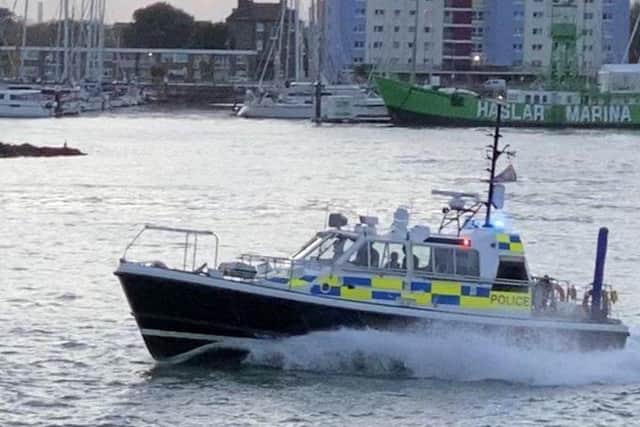 A military police boat heads out of Portsmouth Harbour as part of a mission to end the hijacking of an oil tanker.
