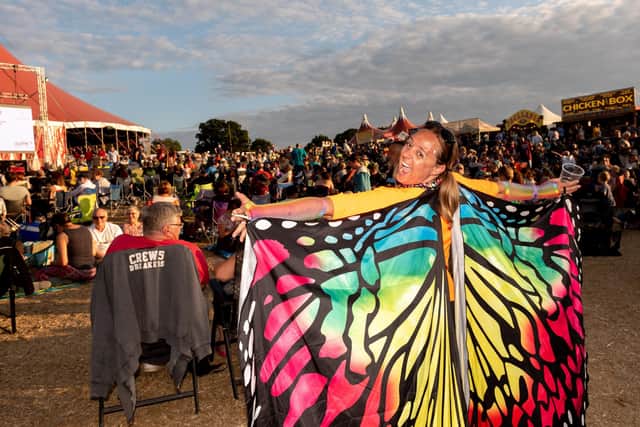 Anna Bispham shows off her butterfly wings outside The Valley Stage at Wickham Festival 2019. Picture: Vernon Nash (030819-017)