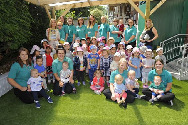 Staff and children at Rainbow Corner Day Nursery where Linda has worked for 28 years.