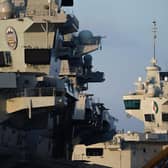 The towers of HMS Prince of Wales (left) and HMS Queen Elizabeth (right) are seen on December 30, 2019 in Portsmouth. (Photo by Peter Summers/Getty Images)