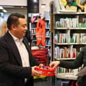 Alan Mak MP hands out chocolate to a postal worker at the Royal Mail's Hayling Island Delivery Office