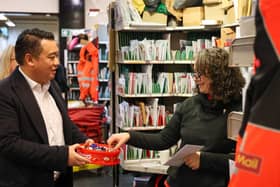 Alan Mak MP hands out chocolate to a postal worker at the Royal Mail's Hayling Island Delivery Office