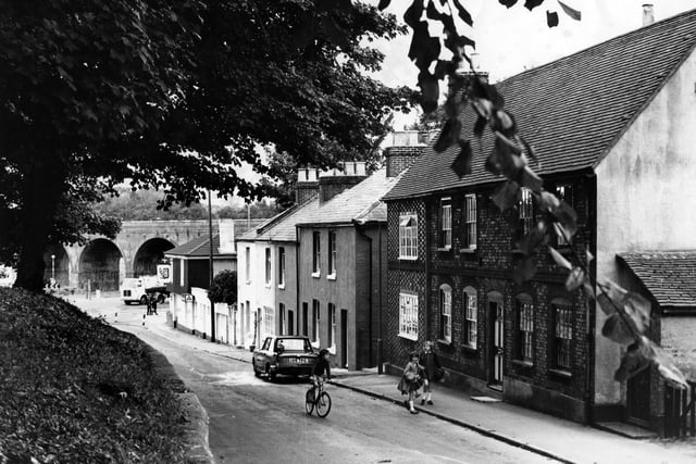 Children walk up the street, Fareham in October 1971. The News PP4688