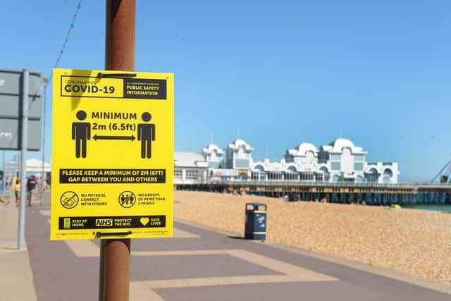 Signs on Southsea promenade reminding people of the need for social distancing. Roads have been closed since March to prevent overcrowding.

Picture: Sarah Standing