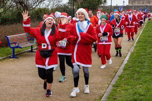 Runners undeterred by the weather start the Santa Fun Run at Southsea Castle