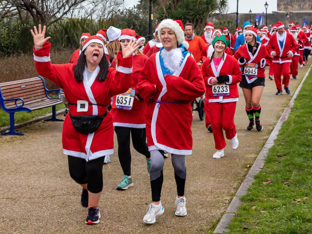 Runners undeterred by the weather start the Santa Fun Run at Southsea Castle