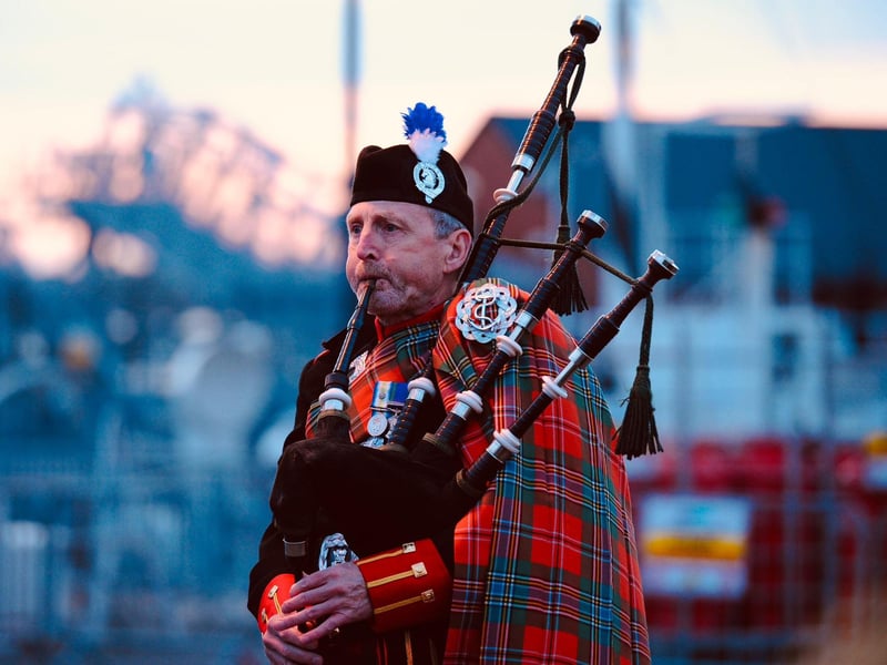A piper playing at the beacon lighting