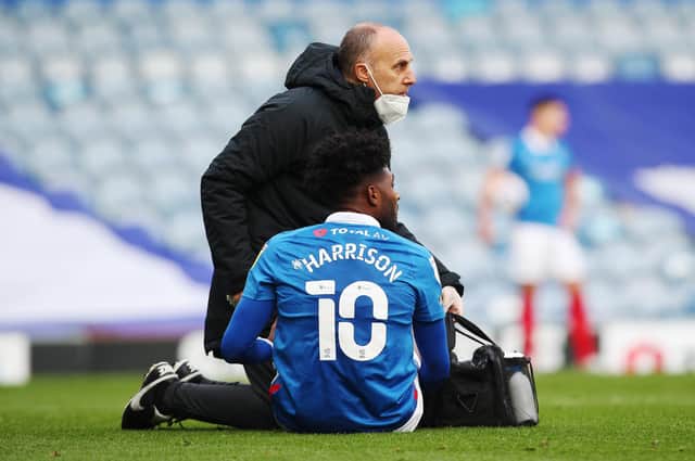 Ellis Harrison receives treatment during Saturday's game against Doncaster Rovers.