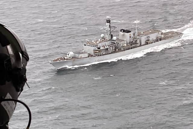 The Merlin's aircrewman looks down on Westminster during her Atlantic patrol