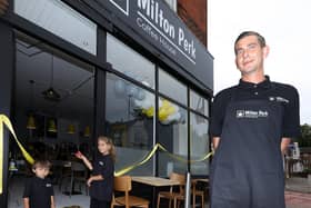 Owner Shaun Carter with his children, Theo, 2, and Olivia, 8, who cut the ribbon. Opening of Milton Perk Coffee House, Milton Rd. Picture: Chris Moorhouse (jpns 190621-05)