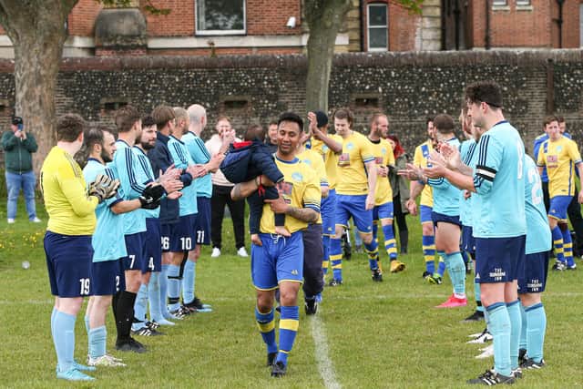 In a sporting gesture, Portchester Rovers give Mid-Solent League champions Meon Milton a guard of honour ahead of the second game of their double header at Eastney Barracks. Picture: Chris Moorhouse