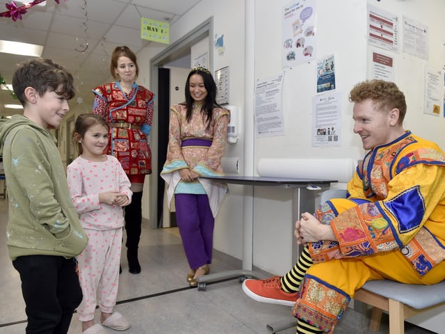 Pictured is: Oscar and Lily-Evelyn Walsh talk to James Oates as Wishee-Washee.