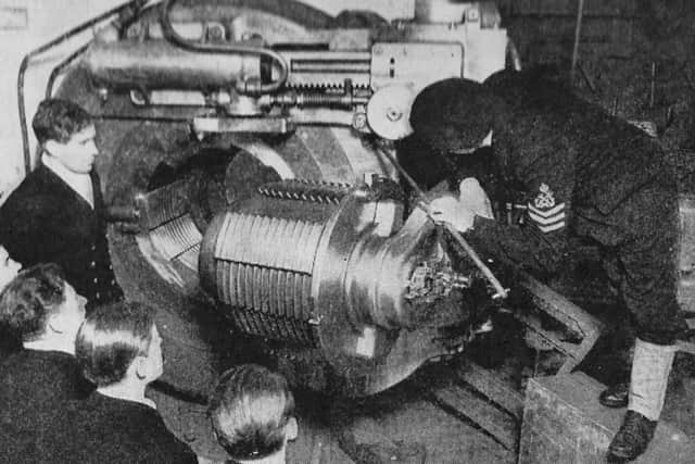 Young sub-lieutenants at HM Gunnery School, Whale Island, Portsmouth, being lectured on the workings of a 15in gun.