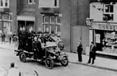 Waterlooville fire engine in a parade for the 1935 Silver Jubilee of George V, passing the Queen's Hotel. This fire engine is a Ford Biaco and was passed on from Havant Brigade when they received a new Fire engine in 1933.