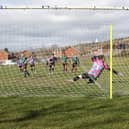 Cross Keys Athletic score from the penalty spot during their 8-0 win over Al's Bar. Picture: Kevin Shipp
