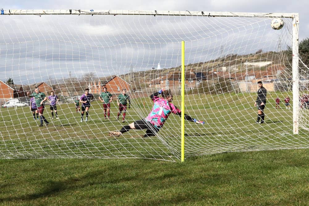 Cross Keys Athletic score from the penalty spot during their 8-0 win over Al's Bar. Picture: Kevin Shipp