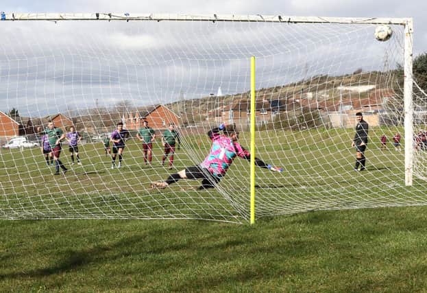 Cross Keys Athletic score from the penalty spot during their 8-0 win over Al's Bar. Picture: Kevin Shipp