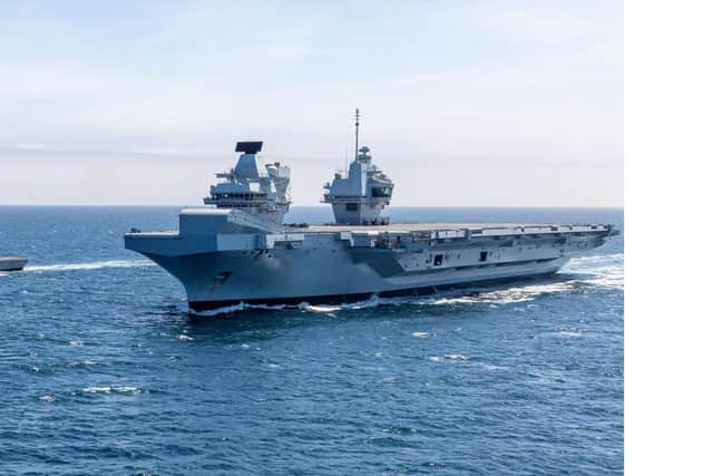 HMS Prince of Wales pictured at sea with HMS Lancaster. It comes as the aircraft carrier had her first run in with a Russian warship at sea. Photo: LPhot Mark Johnson/Royal Navy