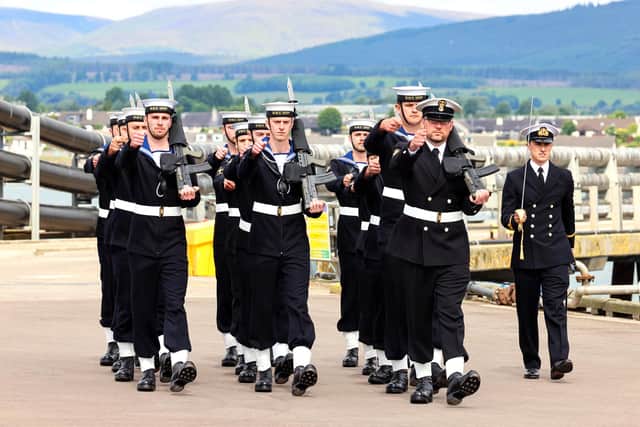HMS Spey's ship's guard marching into the commissioning service.