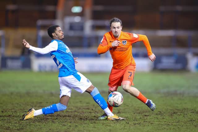 Ryan Williams (7) of Portsmouth brought down by Reece Brown (12) of Peterborough United during the EFL Sky Bet League 1 match between Peterborough United and Portsmouth at London Road, Peterborough, England on 16 March 2021. Picture: Nigel Keene