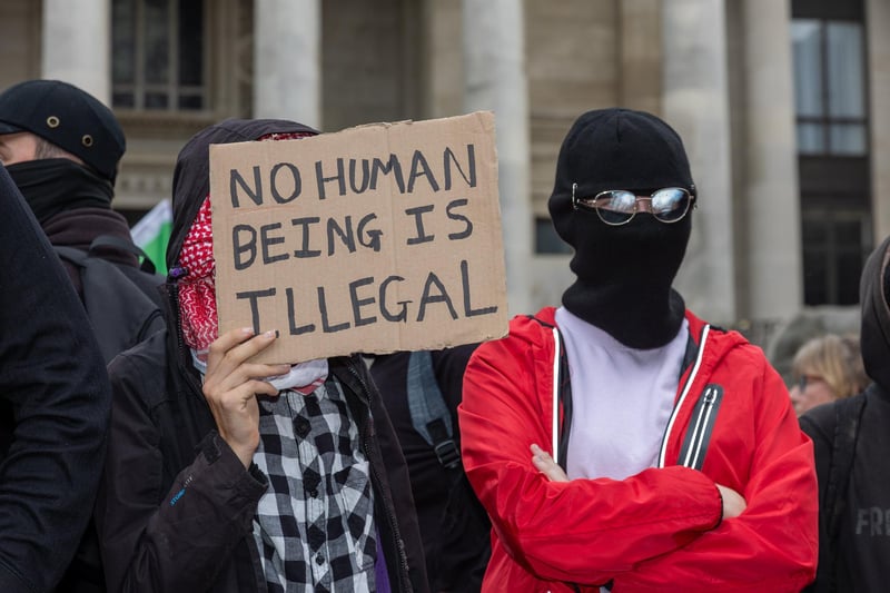 Members of Antifa joined the unity rally with a number of them covering their faces in scarves.