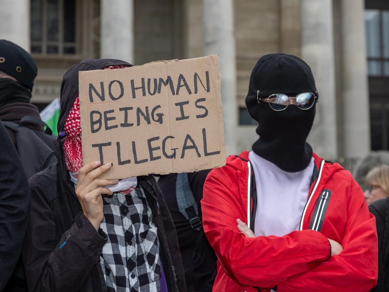 Members of Antifa joined the unity rally with a number of them covering their faces in scarves.