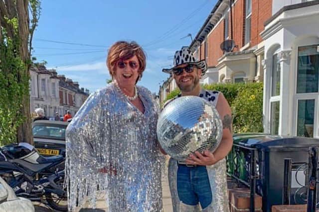 Andrew Pearce as drag act Miss G with husband Rob.