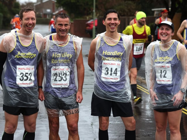 Hardley Runners with their ponchos ahead of the Hayling 10. Picture: Sam Stephenson.