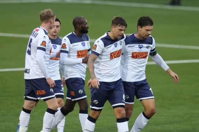 Sam Magri, second right, has just levelled against Oxford City. Picture by Dave Haines.