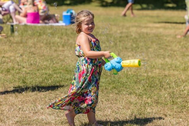 Grace Herron (4) with her bubble gun at the Bandstand. Picture: Mike Cooter (240623)