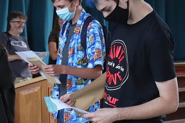 Students at Bourne Community College opening their reults.