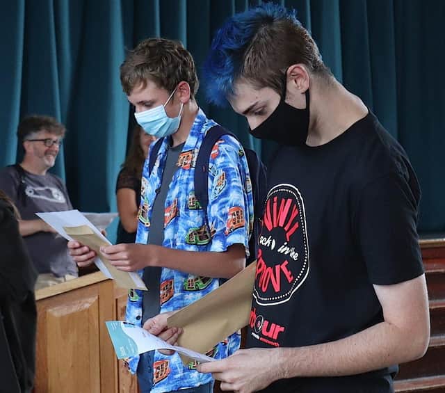 Students at Bourne Community College opening their reults.