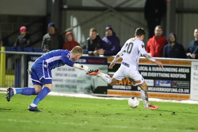 Alfie Rutherford goes past the Slough keeper, only to hit the post. Photo by Dave Haines.