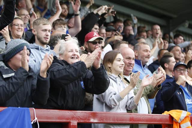 The travelling Pompey fans celebrate Lee Brown's winner at Fleetwood.  Picture: Paul Thompson/ProSportsImages