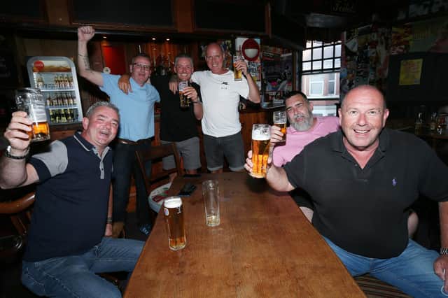 From left, Adam Brown, Garyn Starks, Lee Simmons, Bobby Madwick, Barry Byng and Gordon Perry. Fans watch England v Ukraine in the quarter finals of Euro 2020, in The Kings pub, Albert Rd, SouthseaPicture: Chris Moorhouse (jpns 030721-13)