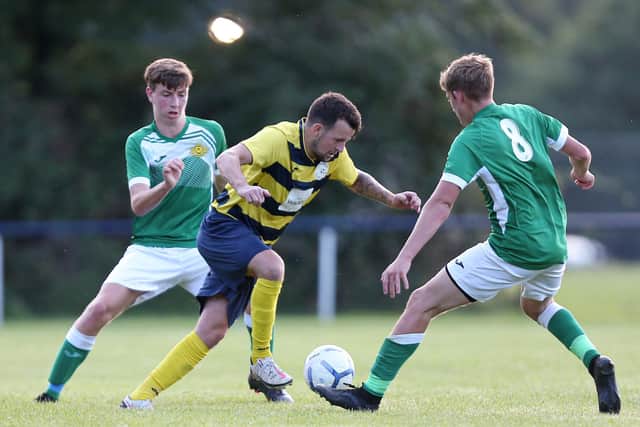 Paulsgrove's Preston Tee (yellow) and Moneyfields' Danny Burroughs (8). Picture: Chris Moorhouse