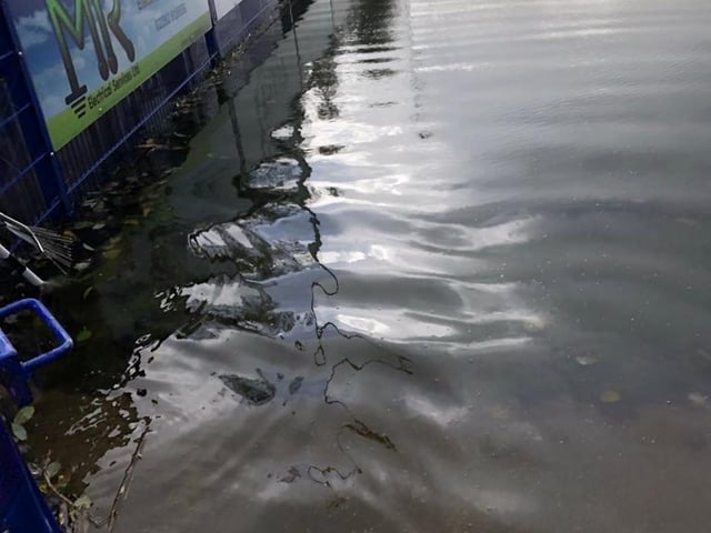 The flooded football ground.
