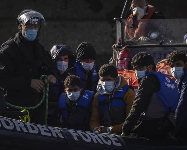 Migrants are brought into Dover docks by Border Force staff on September 9, 2021 in Dover, England (Photo by Dan Kitwood/Getty Images)