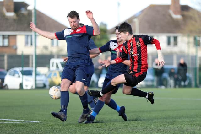 Jack North (stripes) in action against Paulsgrove (blues) - one of the 23 appearances that helped win the teenager his manager's Player of the Season award at Fleetlands. Picture: Chris Moorhouse