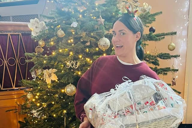 Home Start Portsmouth has been overwhelmed at the number of Christmas hampers that were donated to them.
Pictured: Natasha Solanki, fundraising and communications manager, with some of the Christmas hampers donated.