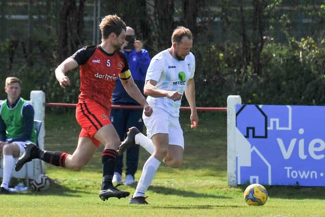 US Portsmouth striker Andrew Todd, right, on the ball at Tavistock. Picture: Martyn White.