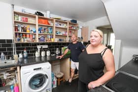 Donna Whitwick and her husband Neil in their kitchen which is in need of repair. Donna says she has been waiting for over a year for her housing association to fix problems in her house. Picture: Stuart Martin (220421-7042)